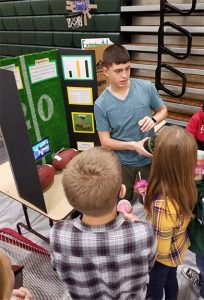 Eric-Davis-presenting-his-Science-Fair-project-to-HMS-students