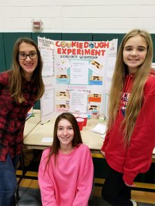 Jaylyn-Houk,-Grace-Banks,-and-Abigail-Camp-in-front-of-their-Science-Fair-project